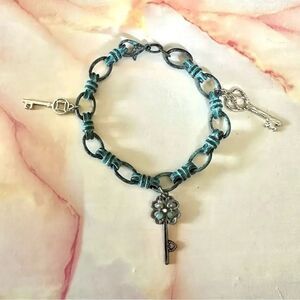 Blue metal key charm bracelet